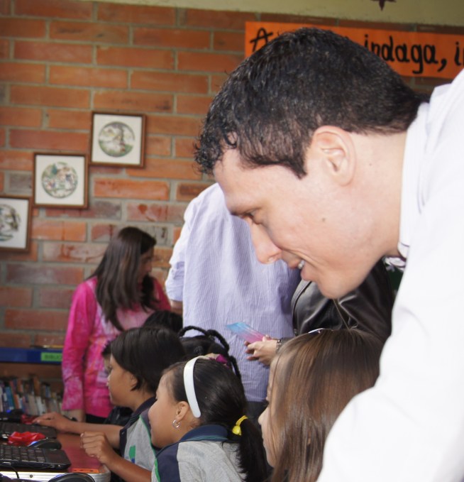 Michael Puscar donating computers to a local Colombian school (Image: Puscar)