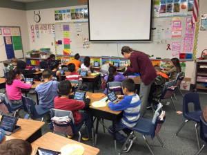 A teacher uses Nearpod to deliver digital curriculum to students' mobile devices, during class.