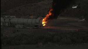 Robotic arm at the end of NASA's booster, extinguishing the flame / Screenshot from NASA livefeed