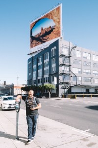 Jordan Ison in front of a billboard in San Francisco featuring his photo. 