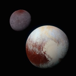 A composite image of Pluto (lower right) and its satellite Charon (upper left) / Image courtesy of NASA