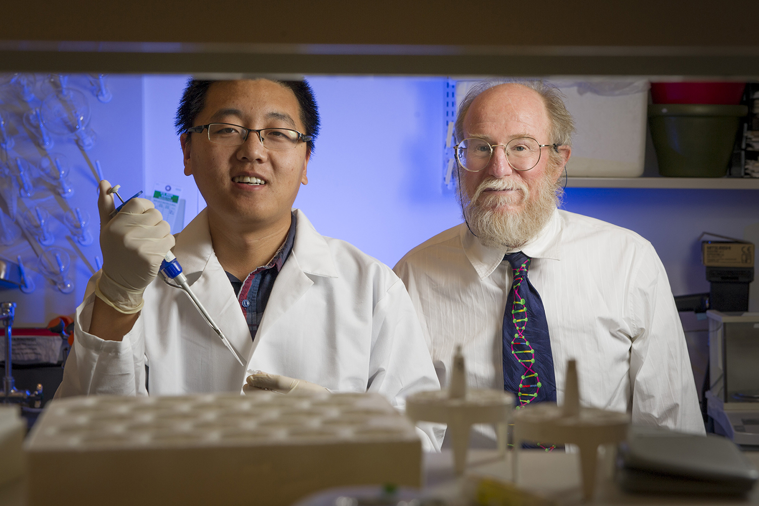 Graduate student Tianqi Song (left) and professor John Reif (right).