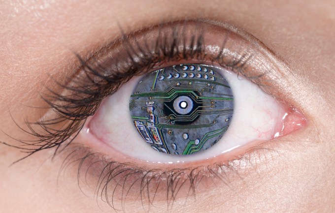 Close Up of blue eye with computer circuit board lines, digital composite