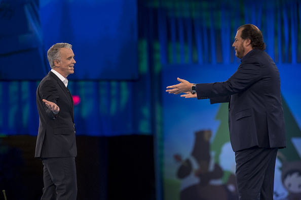 Marc Benioff, chairman and chief executive officer of Salesforce.com Inc., right, greets Parker Harris, co-founder of Salesforce.com Inc., left, during the DreamForce Conference